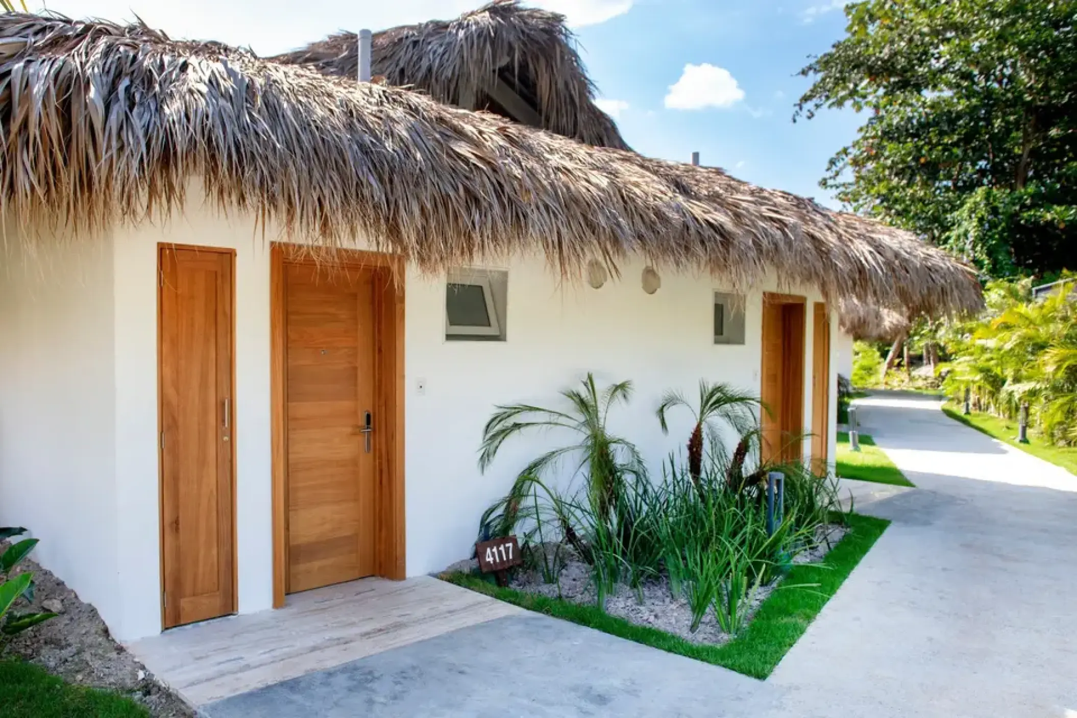 Bungalow guest rooms with thatched roofs at Viva V Samana, Samana