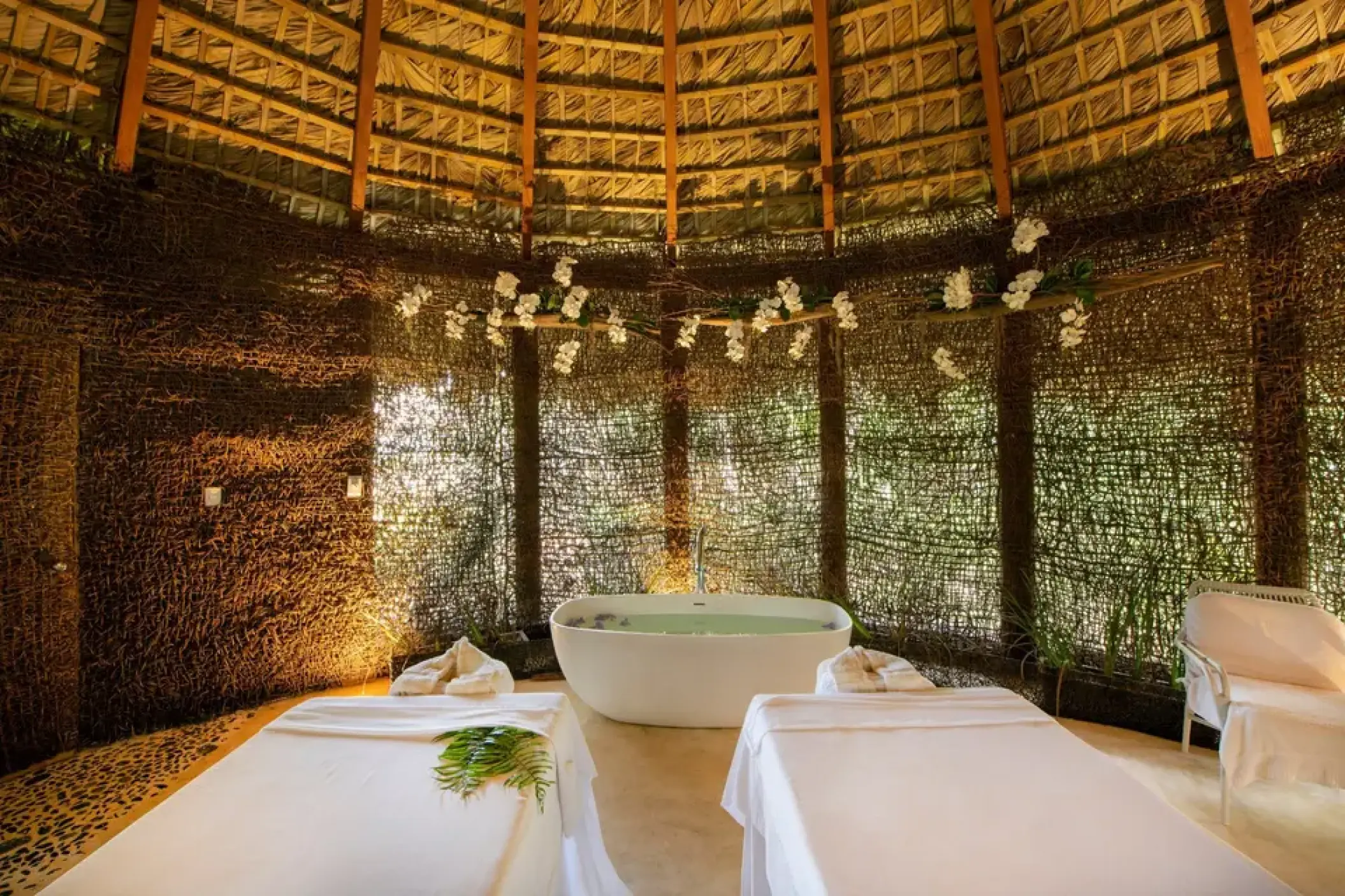 Spa cabin with massage tables and a soaking tub at Viva V Samana, Samana