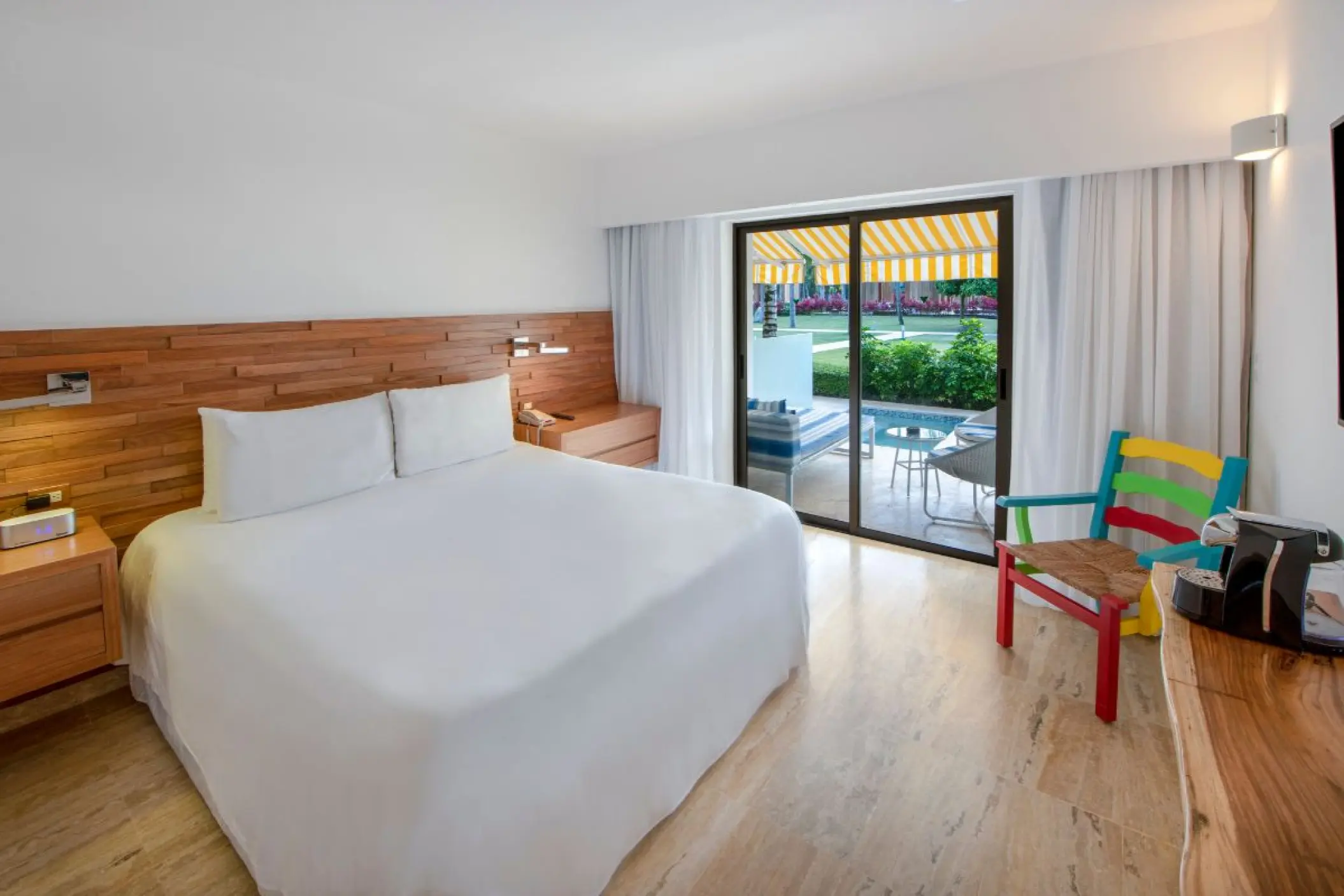 Swim-up suite with wood headboard and terrace access at Viva V Samana, Samana