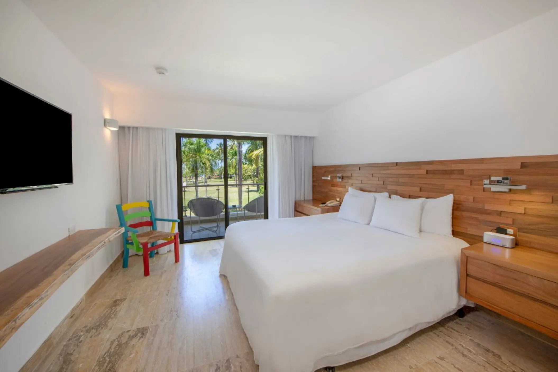 Tropical View Suite with wood headboard and balcony at Viva V Samana, Samana