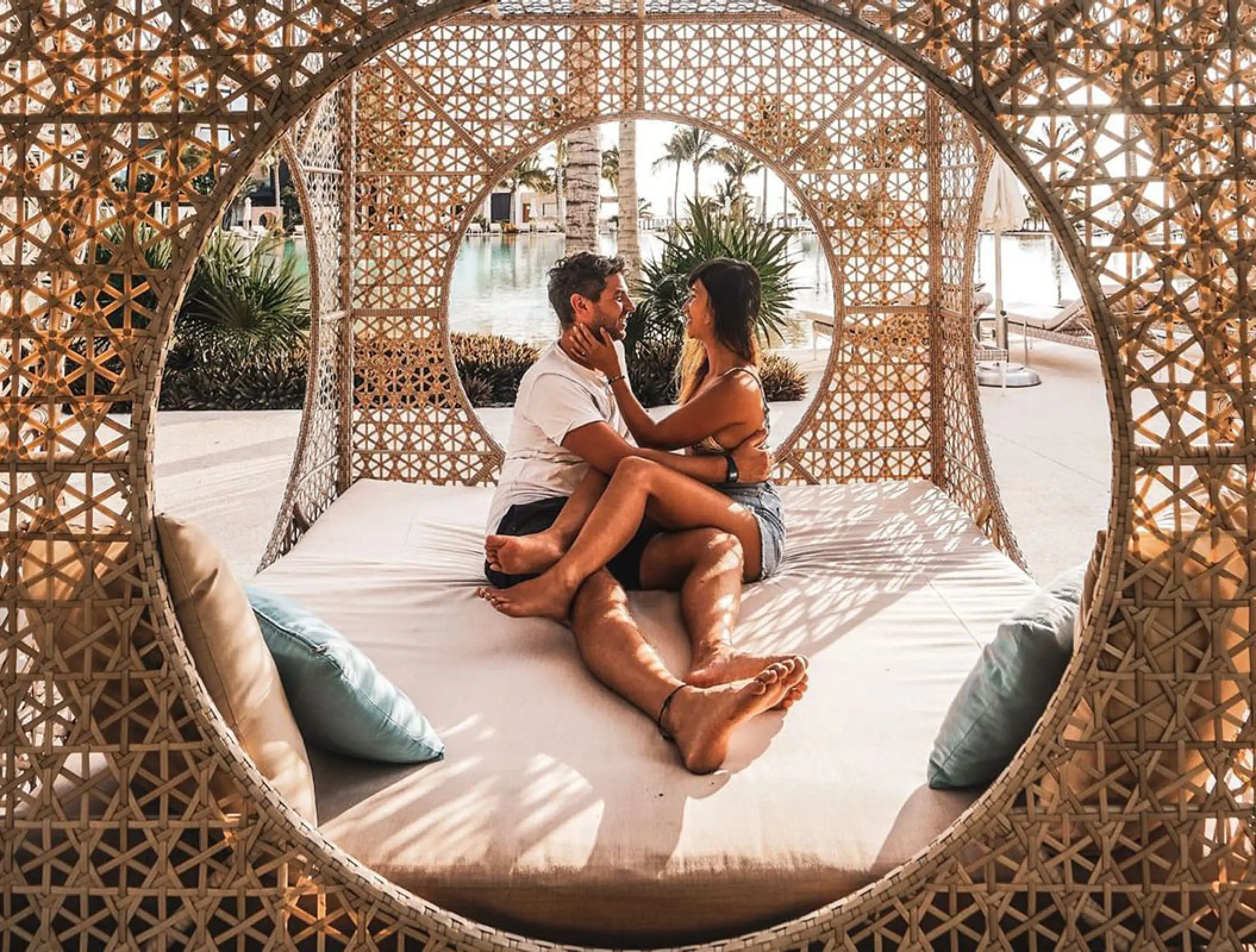 Couple relaxing in a wicker daybed at Haven Riviera Cancun, Riviera Maya