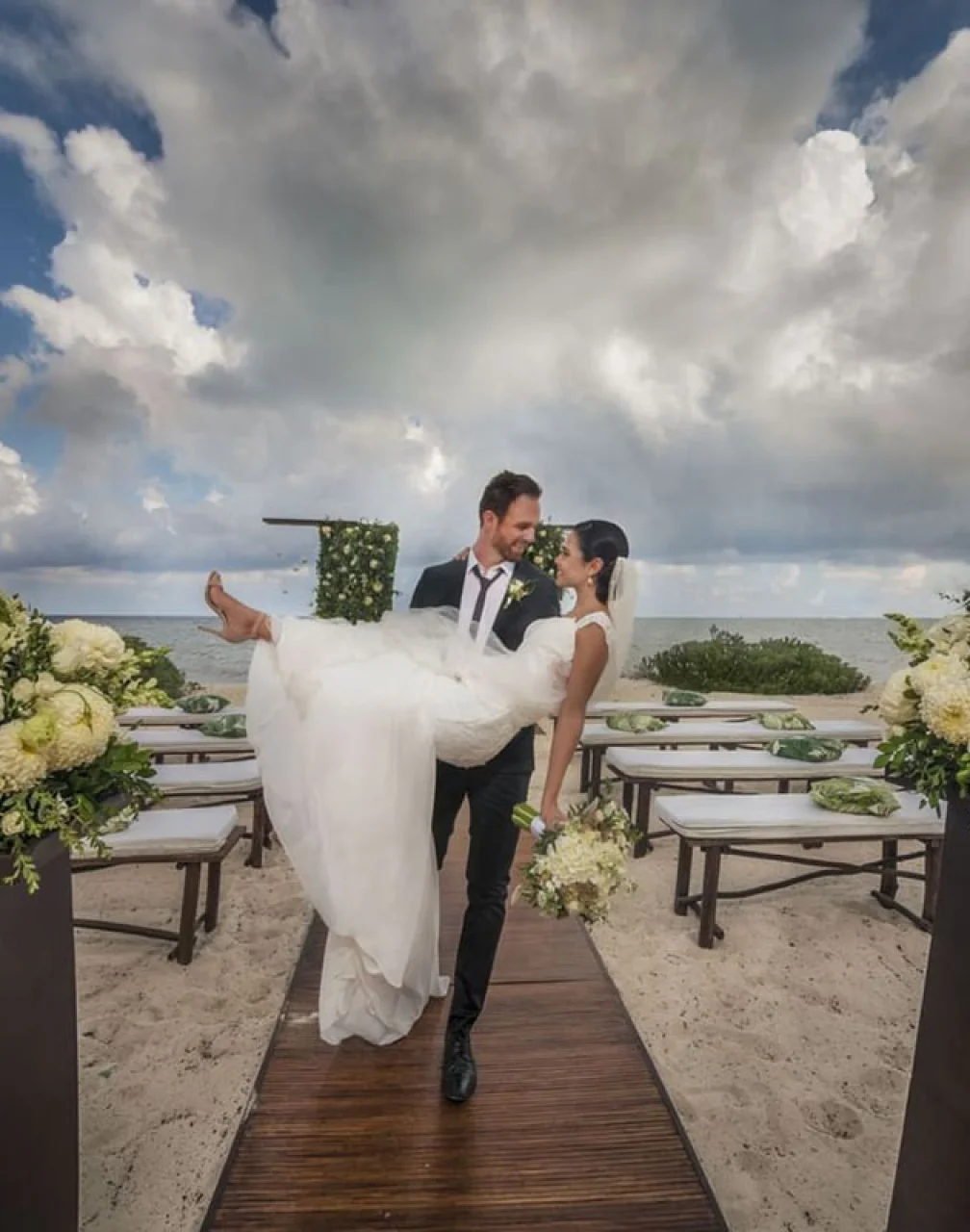 Just married couple walking out the isle at Haven Riviera Cancun.