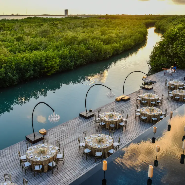 Terra Nostra wedding reception deck beside the canal and mangroves at Nizuc Resort, Cancun