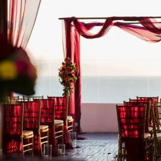 Terrace wedding ceremony with magenta draping at Wyndham Alltra Riviera Nayarit, Puerto Vallarta