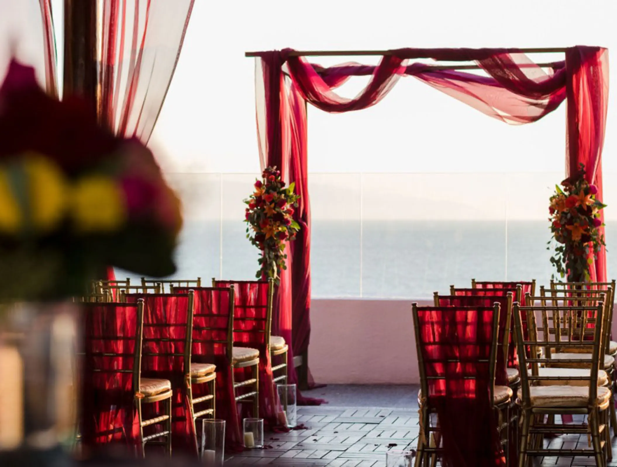 Terrace wedding ceremony with magenta draping at Wyndham Alltra Riviera Nayarit, Puerto Vallarta
