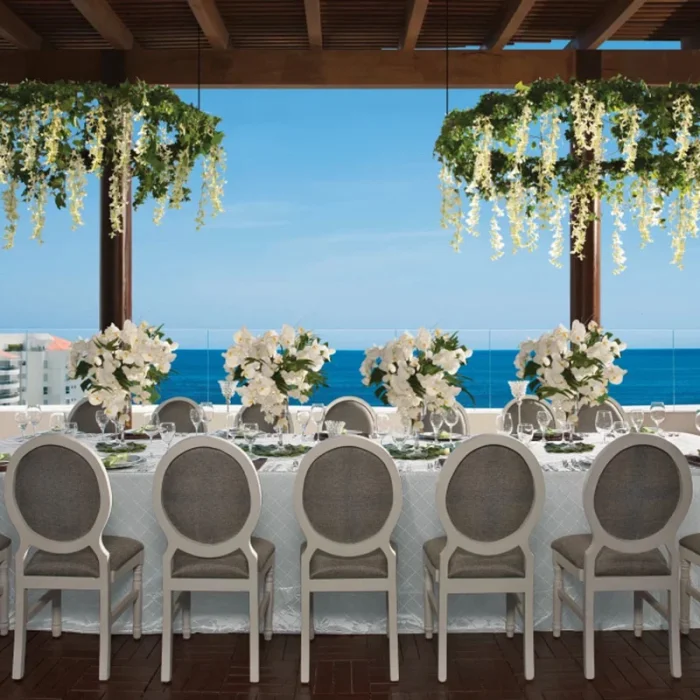Wedding dinner setup on terrace at Wyndham Alltra Riviera Nayarit