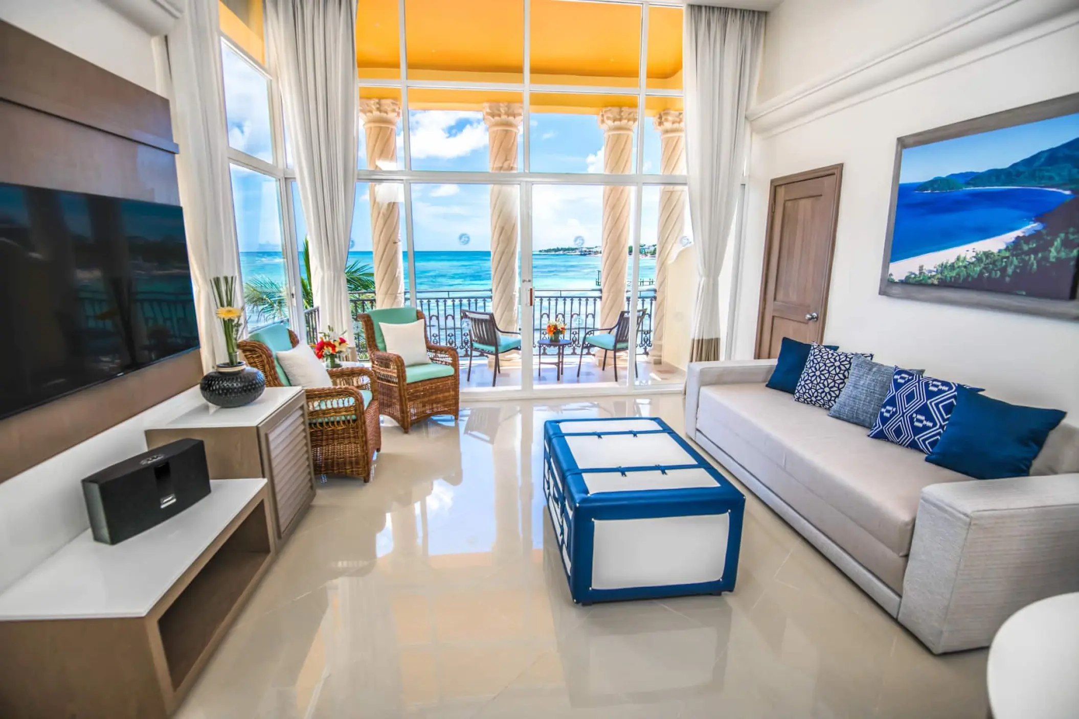 Oceanfront suite living area with balcony overlooking the Caribbean at Wyndham Alltra Playa del Carmen