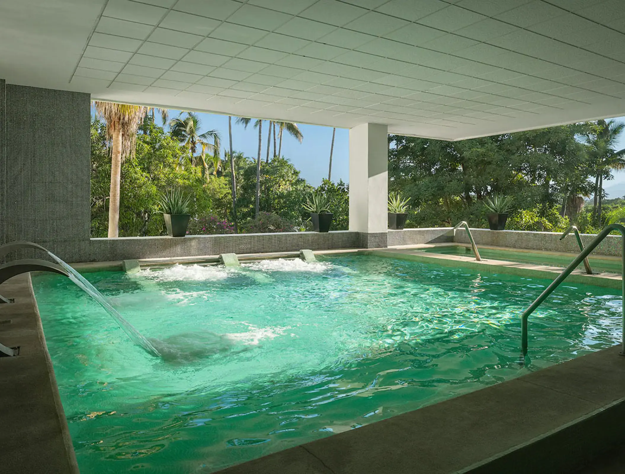 Indoor spa hydrotherapy pool with water jets at Wyndham Alltra Riviera Nayarit, Puerto Vallarta