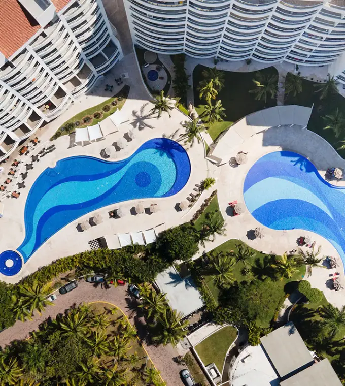 Aerial view of curvy blue pools at Wyndham Alltra Riviera Nayarit, Puerto Vallarta