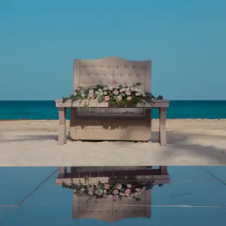 Outdoor wedding reception sweetheart table on the beach at Sunscape Cancun