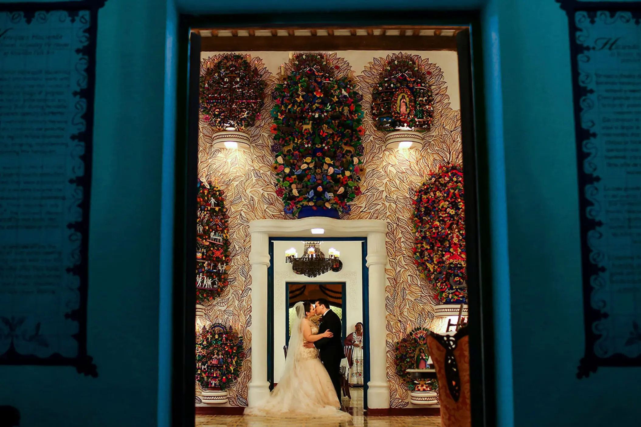 Bride and groom kissing in the Guadalupe Chapel at Hotel Xcaret Mexico, Riviera Maya