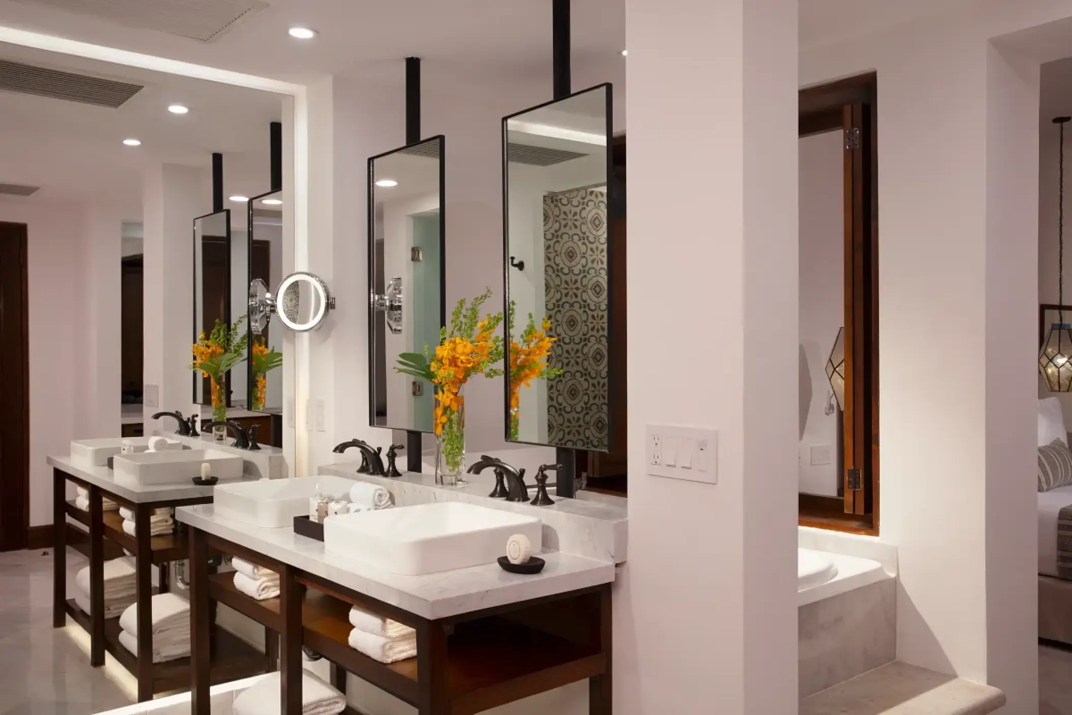 Modern suite bathroom with double vanity and mirrors at Zoetry Casa del Mar, Cabo San Lucas