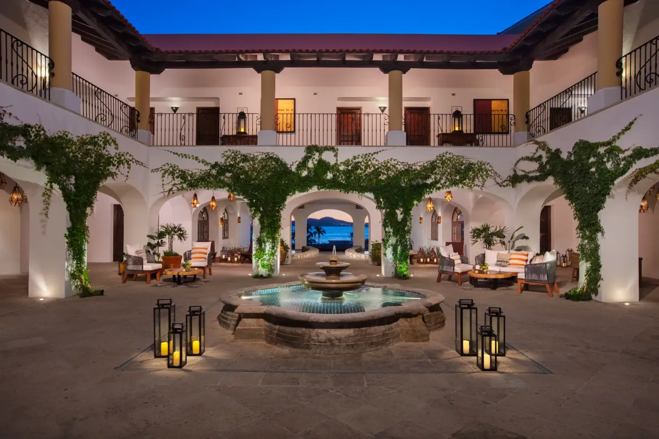 Hacienda-style courtyard with a central fountain and lanterns at Zoetry Casa del Mar, Cabo San Lucas