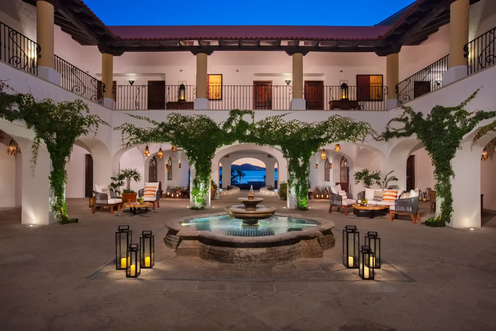 Hacienda-style courtyard with a central fountain and lanterns at Zoetry Casa del Mar, Cabo San Lucas
