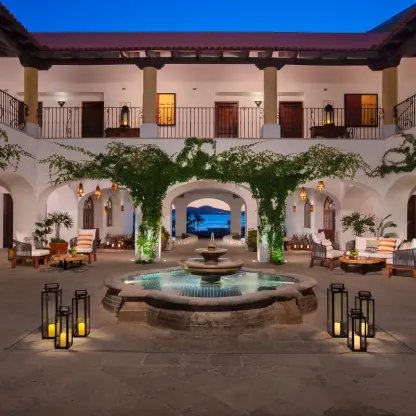 Hacienda-style courtyard with a central fountain and lanterns at Zoetry Casa del Mar, Cabo San Lucas