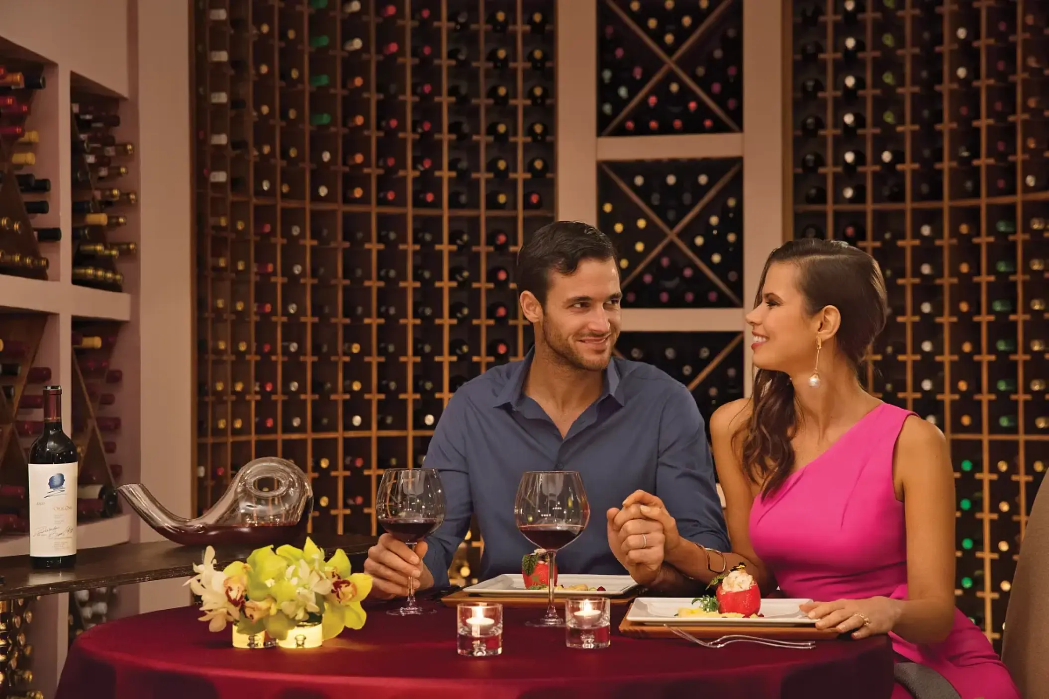 Couple enjoying a private dinner in the wine cellar at Zoetry Casa del Mar, Cabo San Lucas