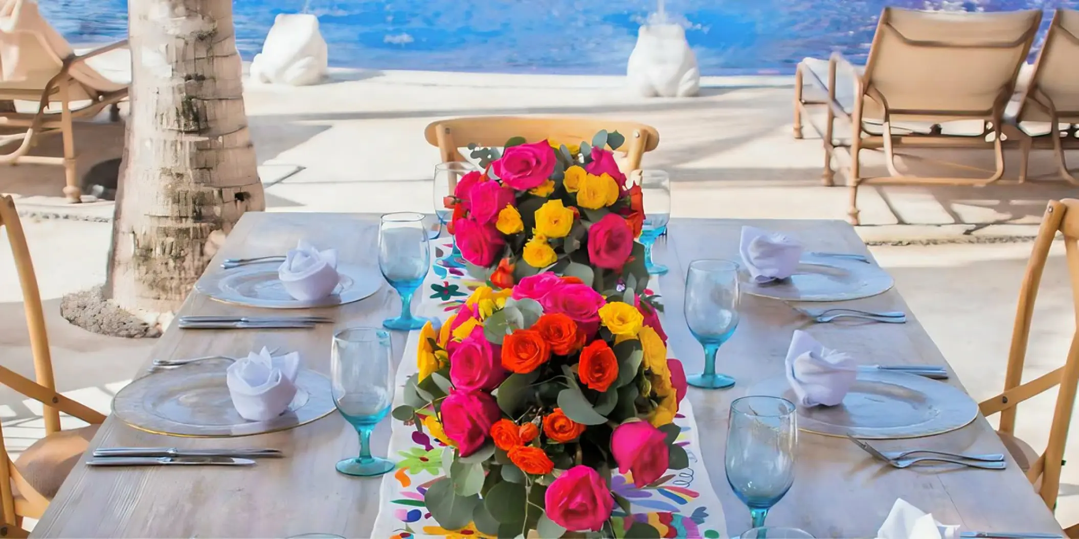 Colorful floral centerpieces for a wedding reception at Zoetry Paraiso de la Bonita, Riviera Maya
