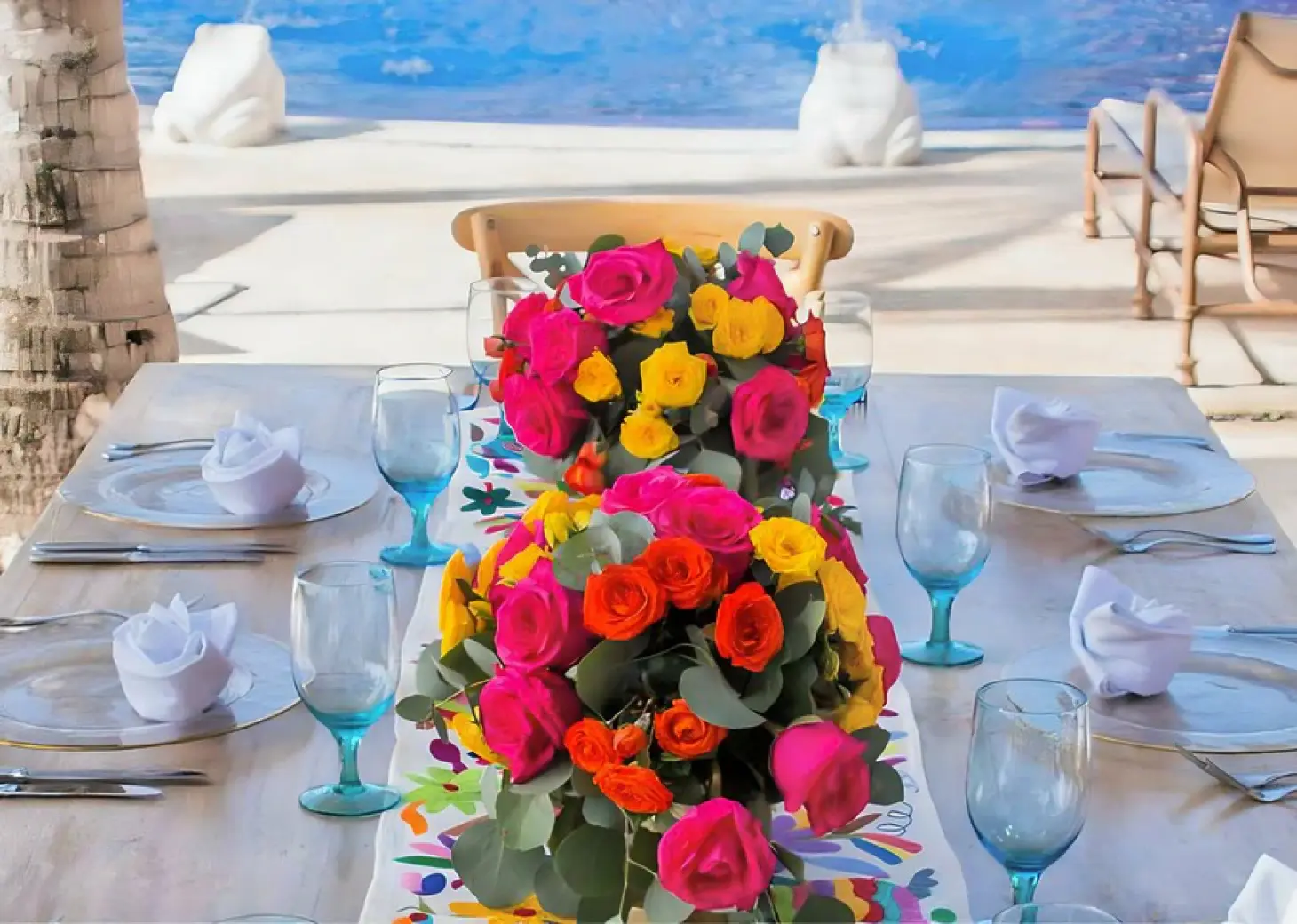 Colorful floral centerpieces for a wedding reception at Zoetry Paraiso de la Bonita, Riviera Maya