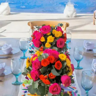 Colorful floral centerpieces for a wedding reception at Zoetry Paraiso de la Bonita, Riviera Maya