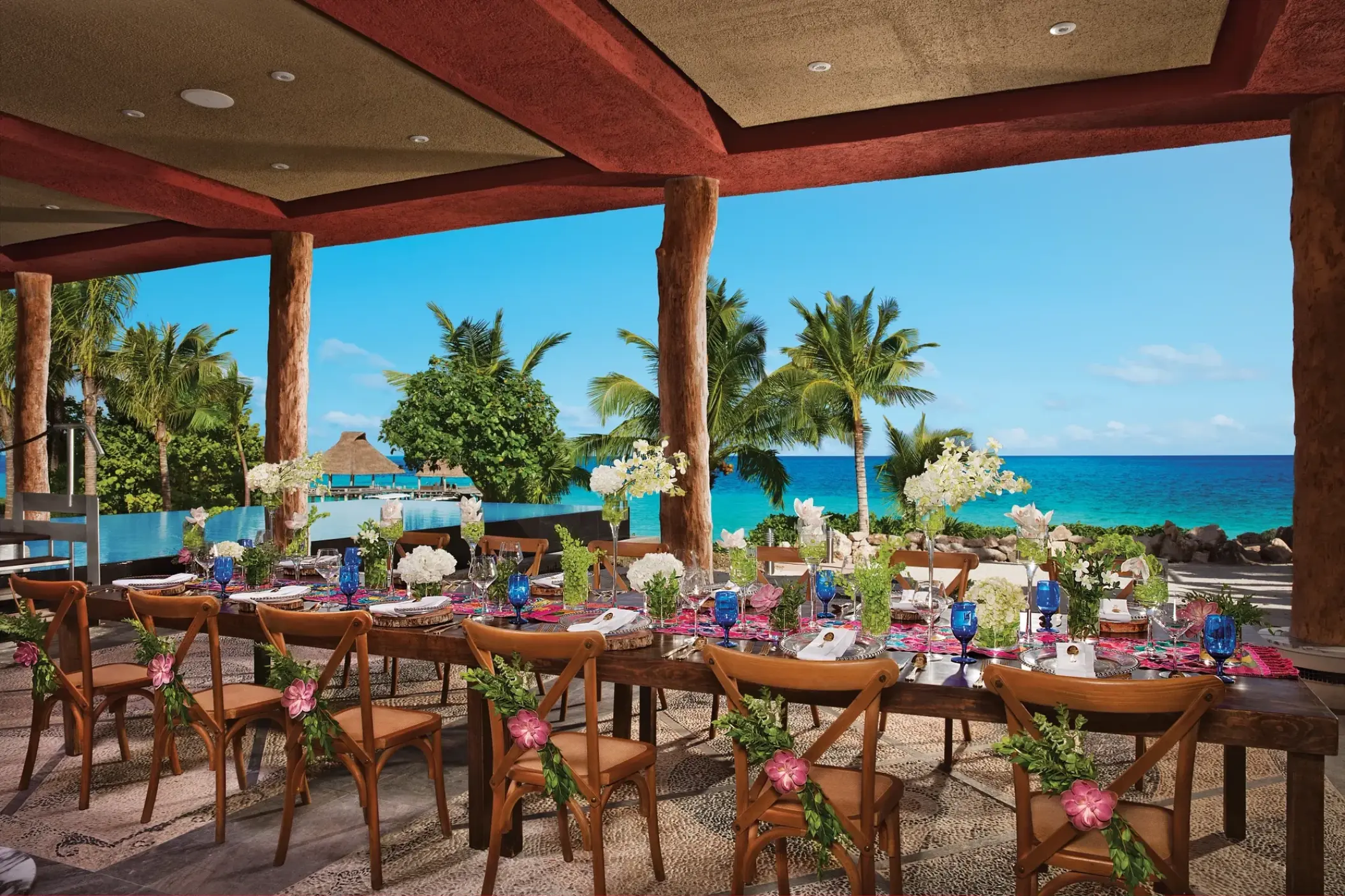 Outdoor wedding reception setup with ocean views at Zoetry Paraiso de la Bonita