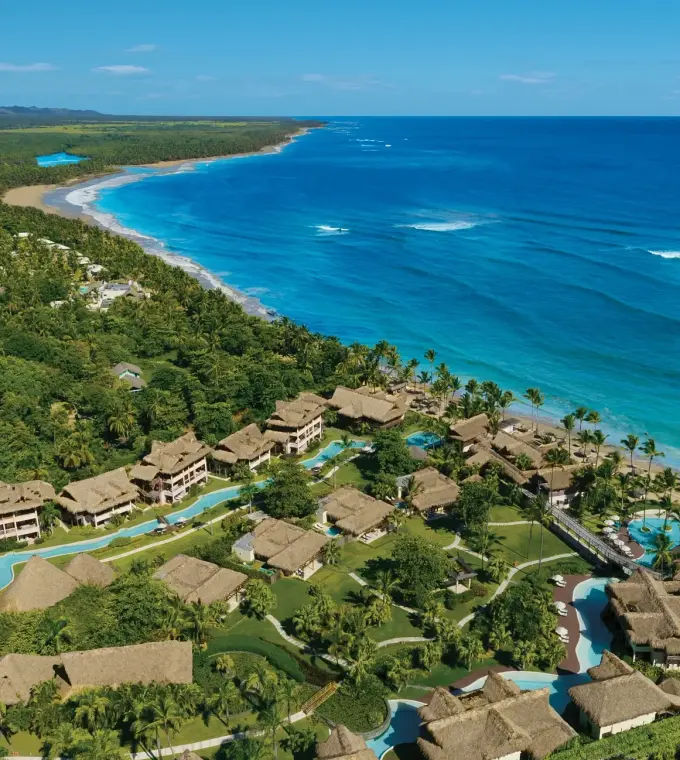 Aerial view of Zoetry Agua Punta Cana beachfront suites and pools along the Caribbean coastline, Punta Cana