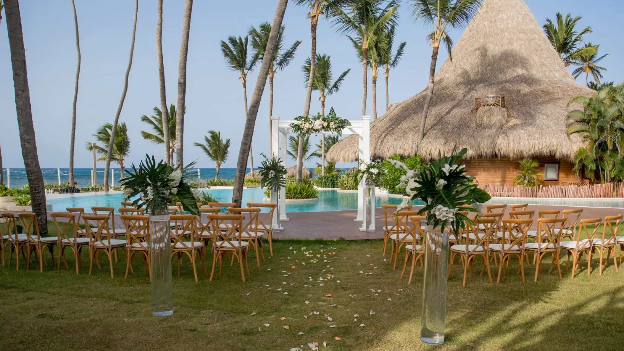 Garden wedding ceremony setup by the pool at Zoetry Agua, Punta Cana