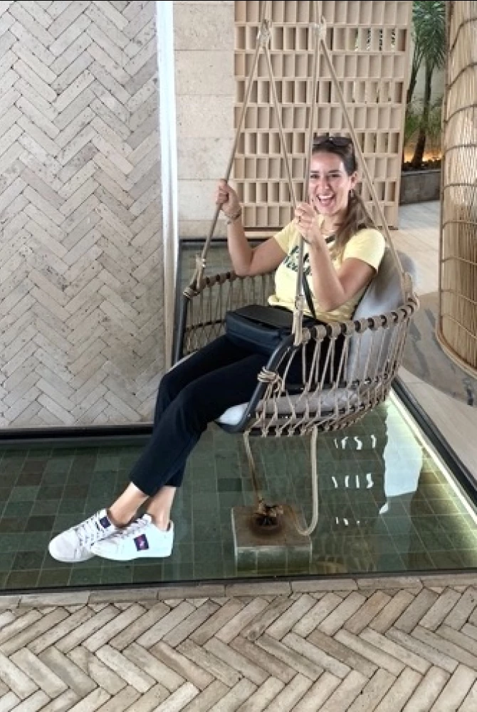 Lucie sitting in chair at Secrets Moxche resort