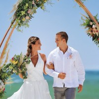 Couple at wedding ceremony in beach venue at allegro playacar resort