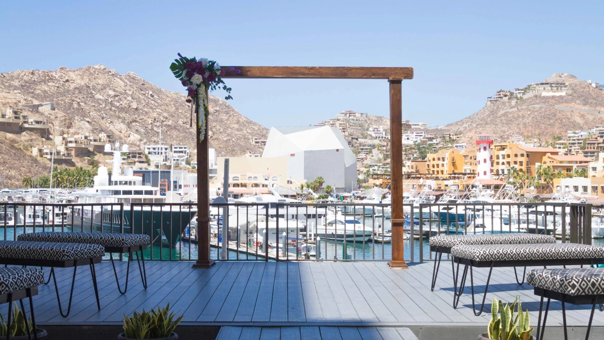 Ceremony decor on purple rooftop lounge at Breathless Cabo San Lucas Resort and Spa