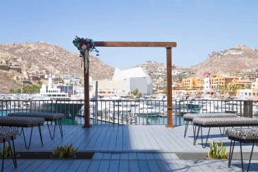Ceremony decor on purple rooftop lounge at Breathless Cabo San Lucas Resort and Spa