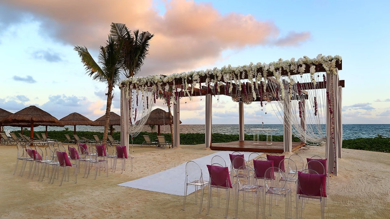 Breathless Riviera Cancun beach wedding with seats and altar