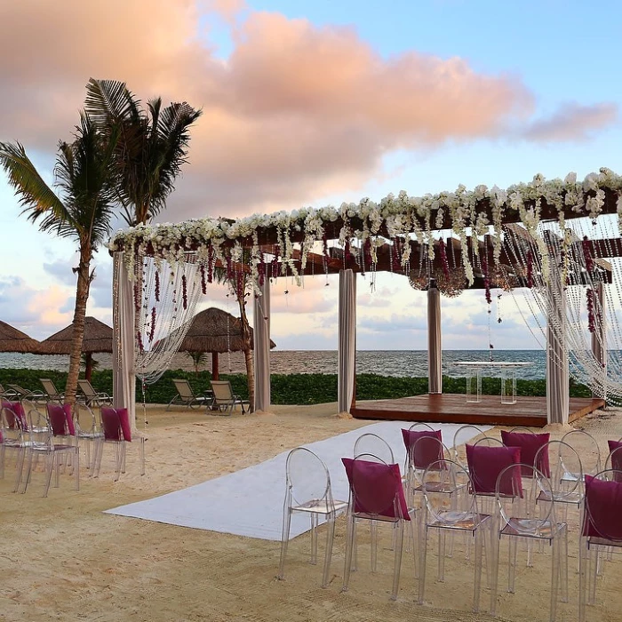 Breathless Riviera Cancun beach wedding with seats and altar