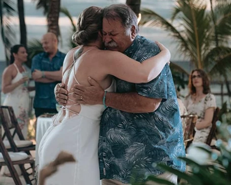 bride hugs her father and both get emotional at their father and doughter dance