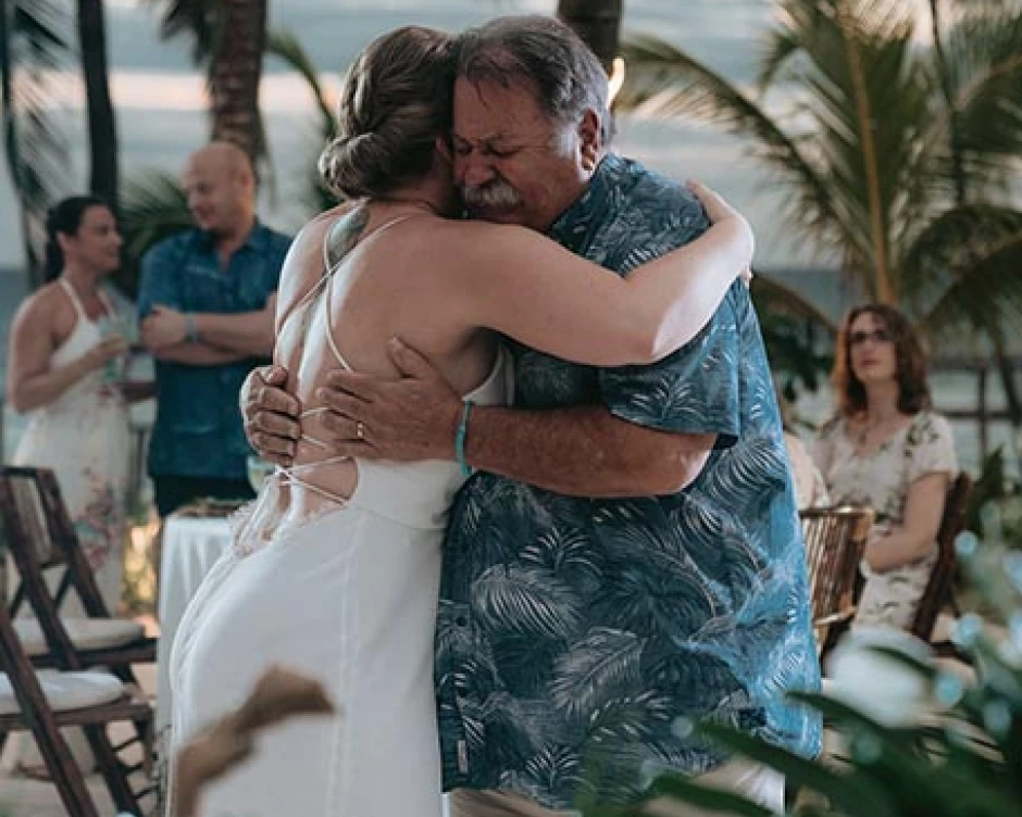 bride hugs her father and both get emotional at their father and doughter dance