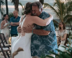 bride hugs her father and both get emotional at their father and doughter dance