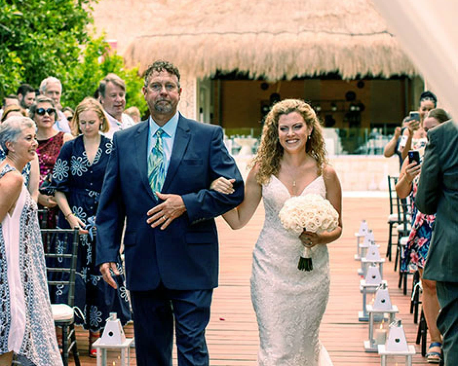 bride and dad walking down the isle