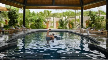 Conrad Tulum couple at the spa pool.