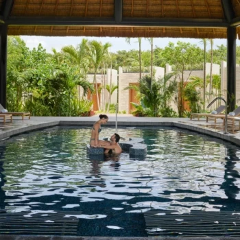 Conrad Tulum couple at the spa pool.
