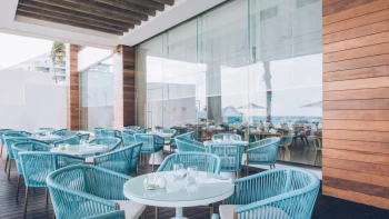 Coral Level Iberostar Cancun outdoor restaurant blue seating