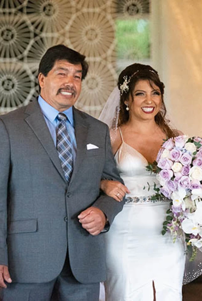 brride walking down the isle with her father