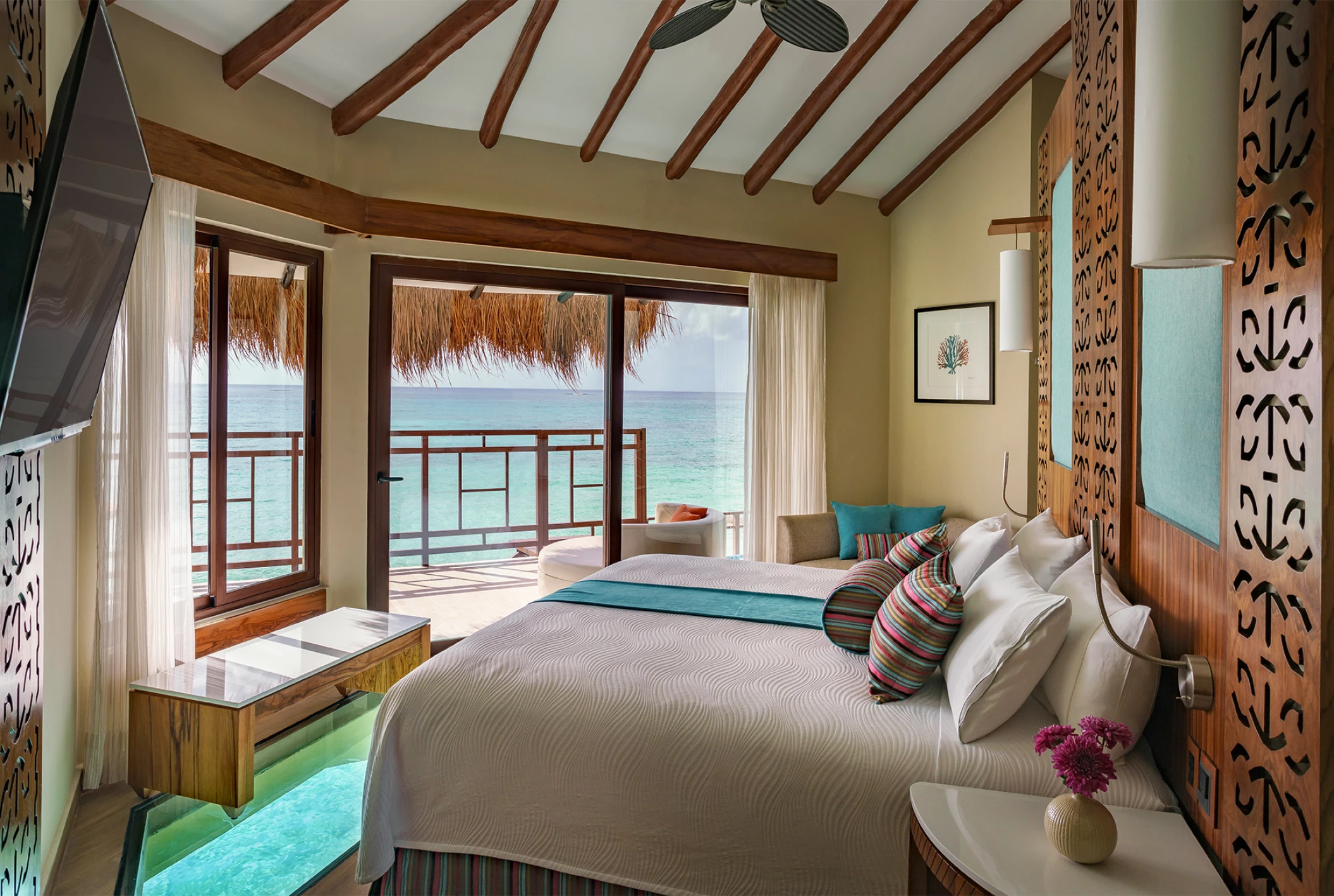 El Dorado Maroma over water bungalow room with bed