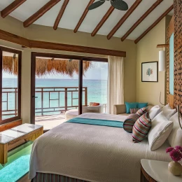 El Dorado Maroma over water bungalow room with bed