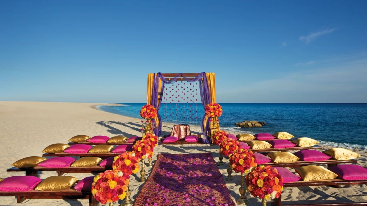 Ceremony decor on the beach at Dreams Los Cabos Suites Golf Resort & Spa