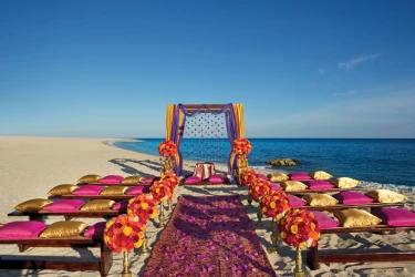 Ceremony decor on the beach at Dreams Los Cabos Suites Golf Resort & Spa