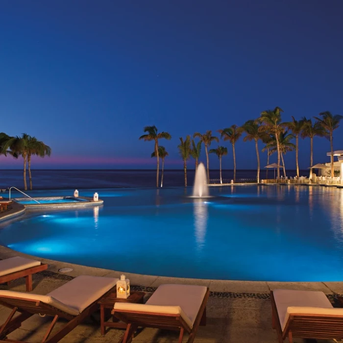 Nights vibes at the main pool at Dreams Los Cabos Suites Golf Resort & Spa