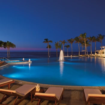 Nights vibes at the main pool at Dreams Los Cabos Suites Golf Resort & Spa