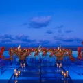 Infinity wedding reception red flowers at Dreams Natura Resort and Spa