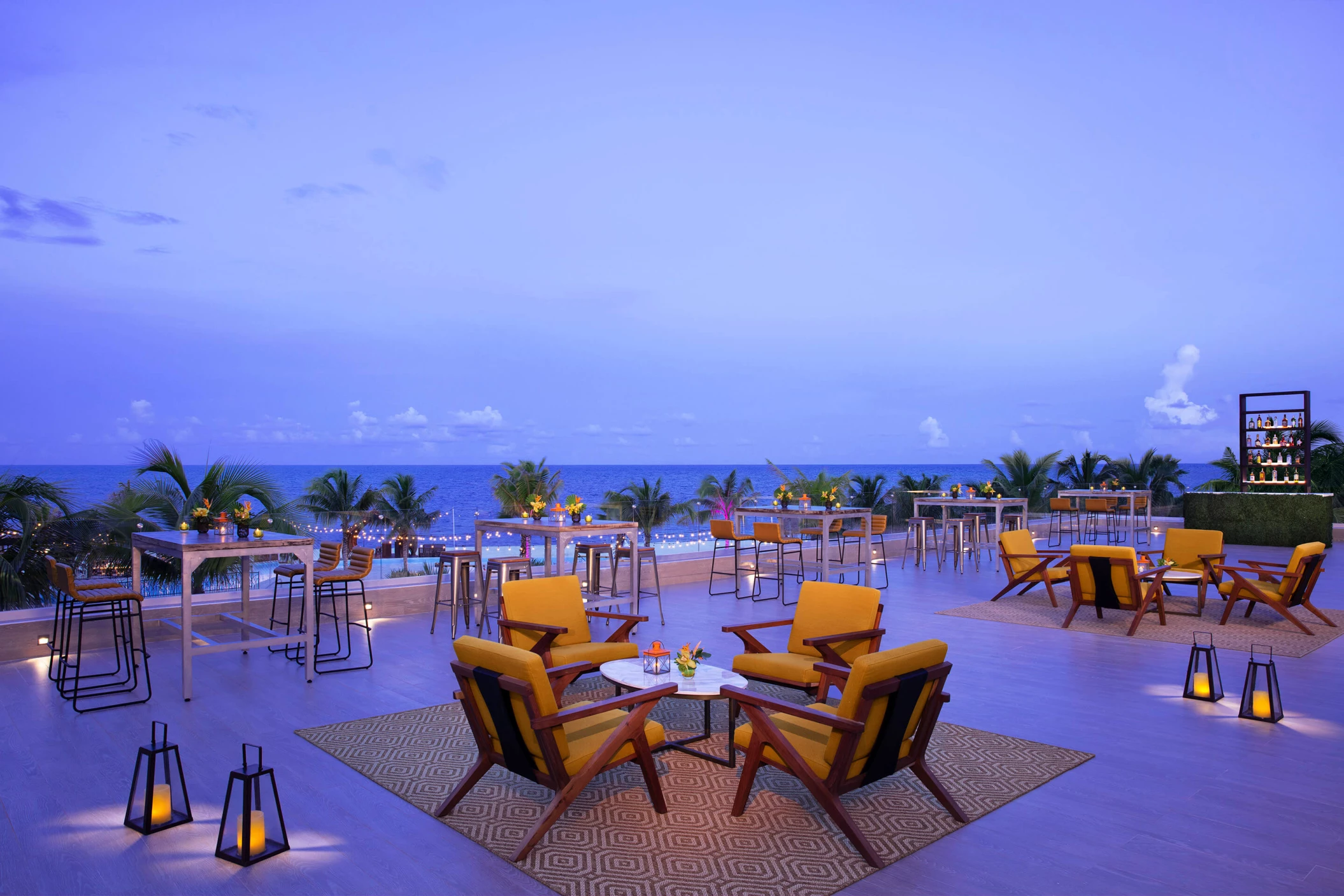 Rooftop wedding reception with bar at Dreams Natura Resort and Spa