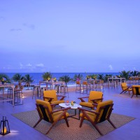 Rooftop wedding reception with bar at Dreams Natura Resort and Spa