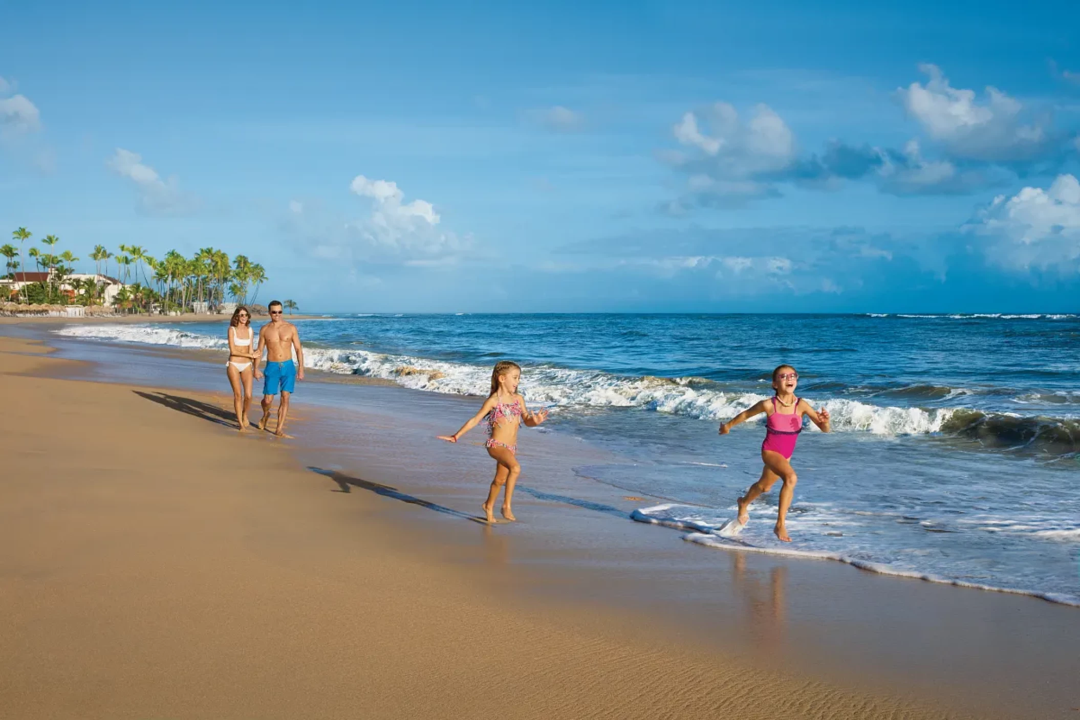 Family on the beach at Dreams Onyx Resort & Spa